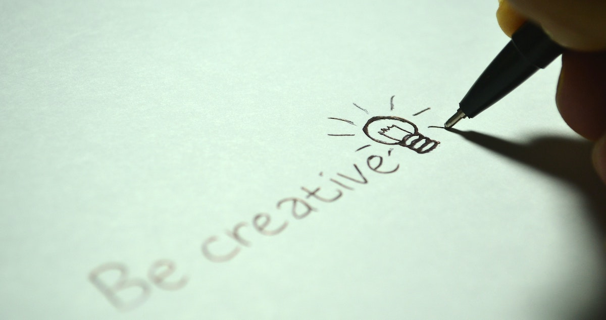 creative thinking: pencil drawing a lightbulb