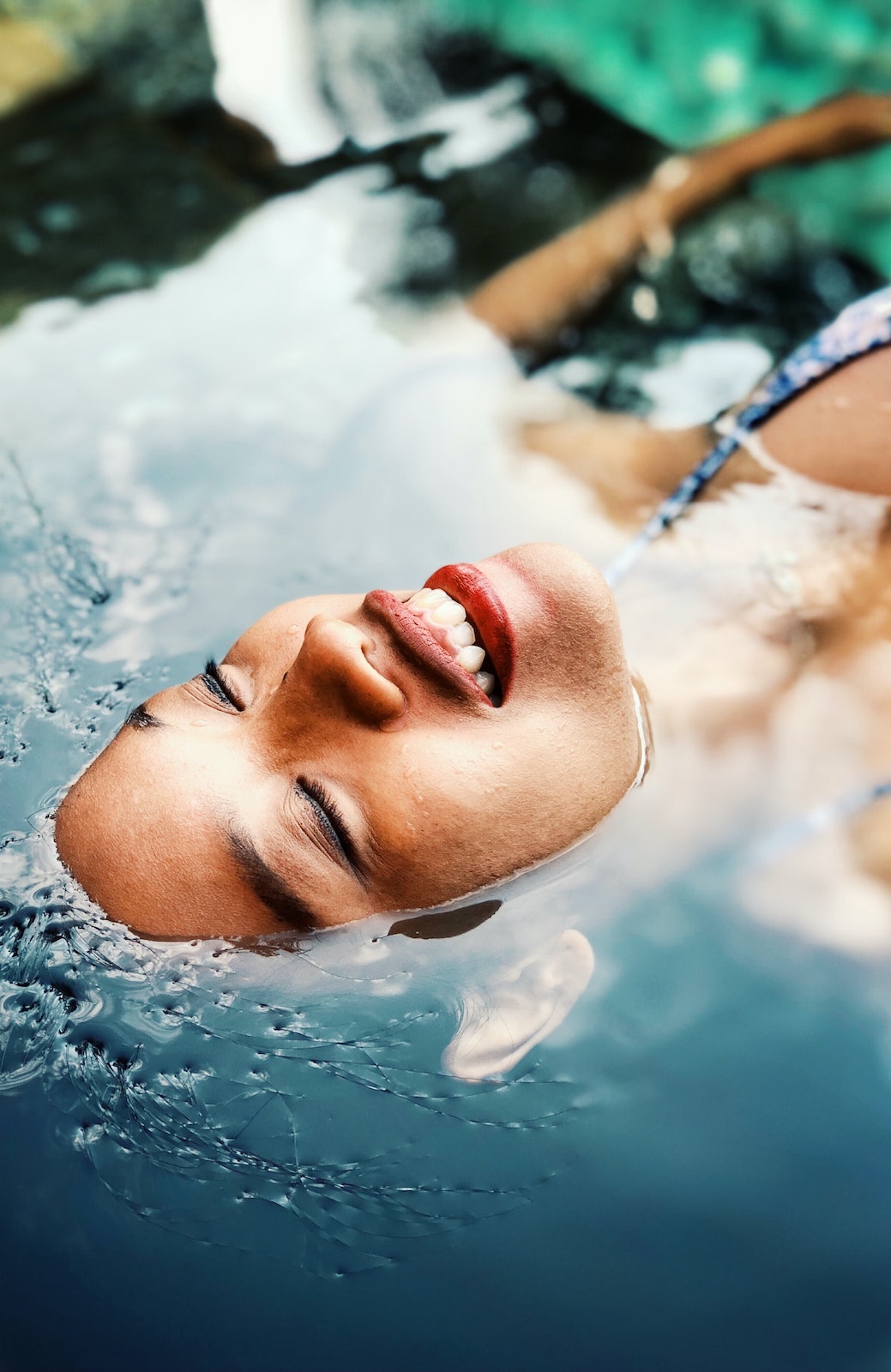 pic of woman lying in pool