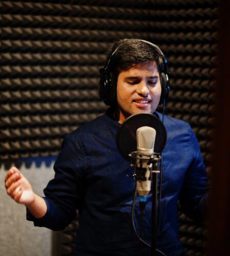 Localization: Indian voice actor in front of a mic