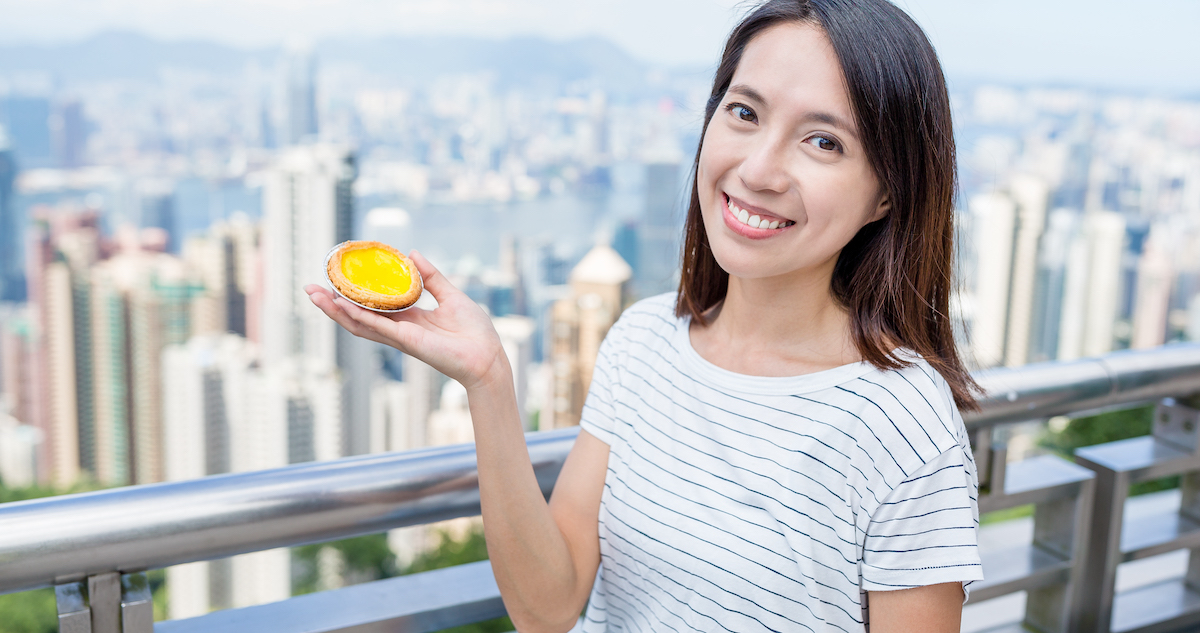 Localization: image of a young woman holding local food