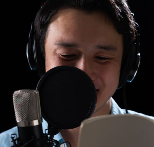 Unique brand voice: image of a professional voice actor in a studio