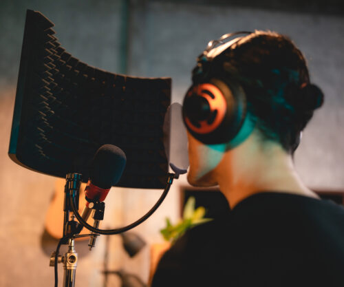 hire freelancers: image of a voice actor behind the mic