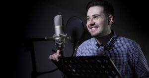 What is a voice over: image of a voice actor in a dubbing studio